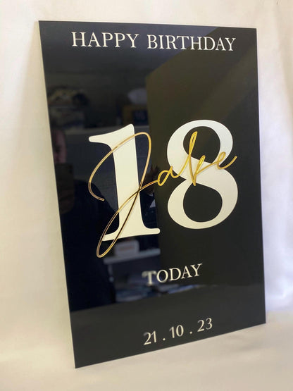 Black Acrylic Birthday Welcome Sign with gold text 'Happy Birthday Jake 18 Today' on a white background