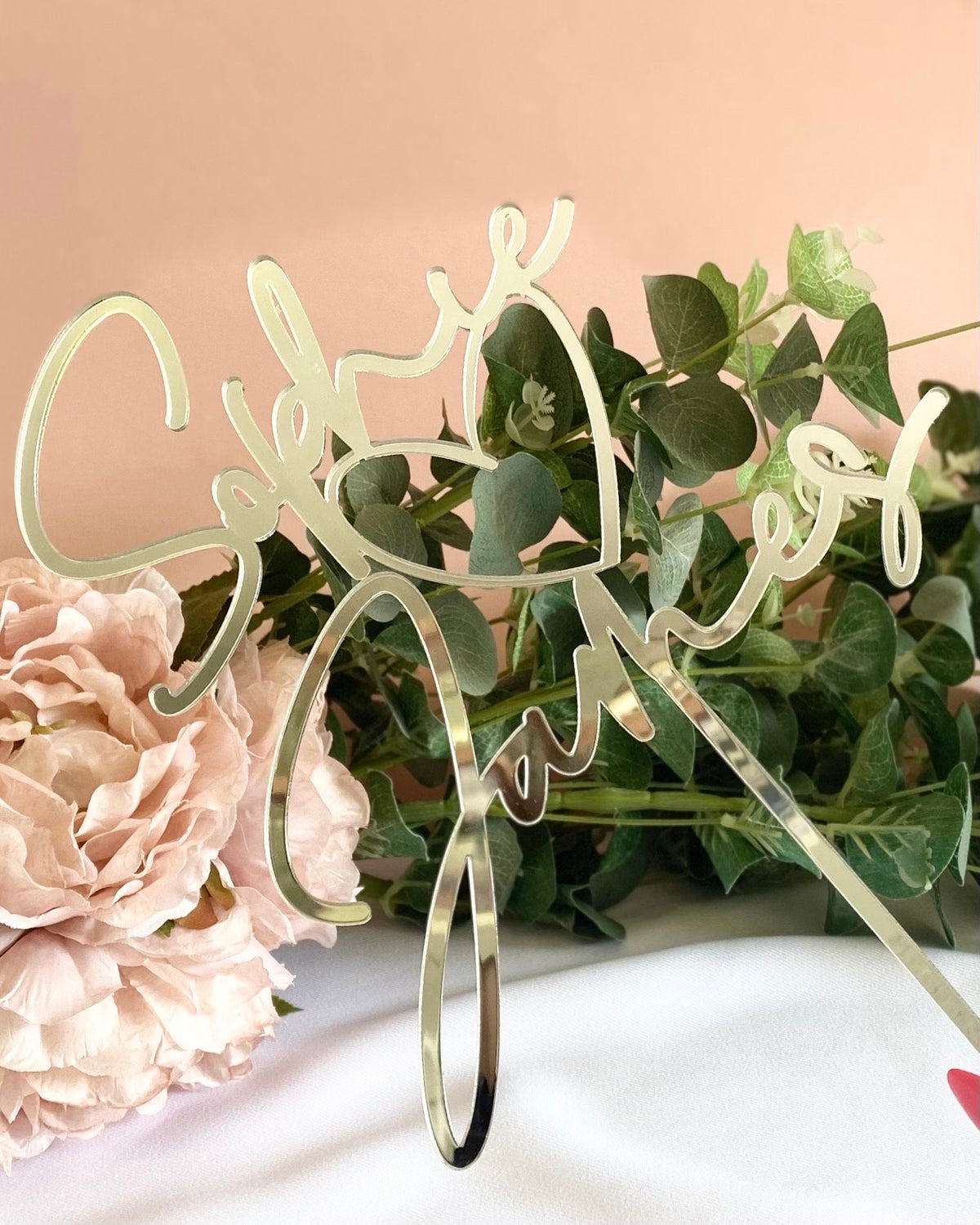 Decorative cake topper with 'couples names and heart detail perfect for weddings or engagement