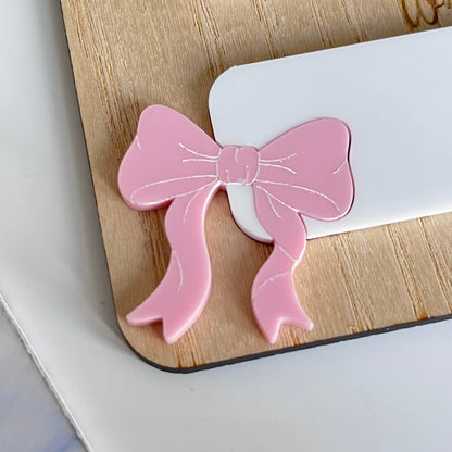 close up of on of the pink bows on the back to school board