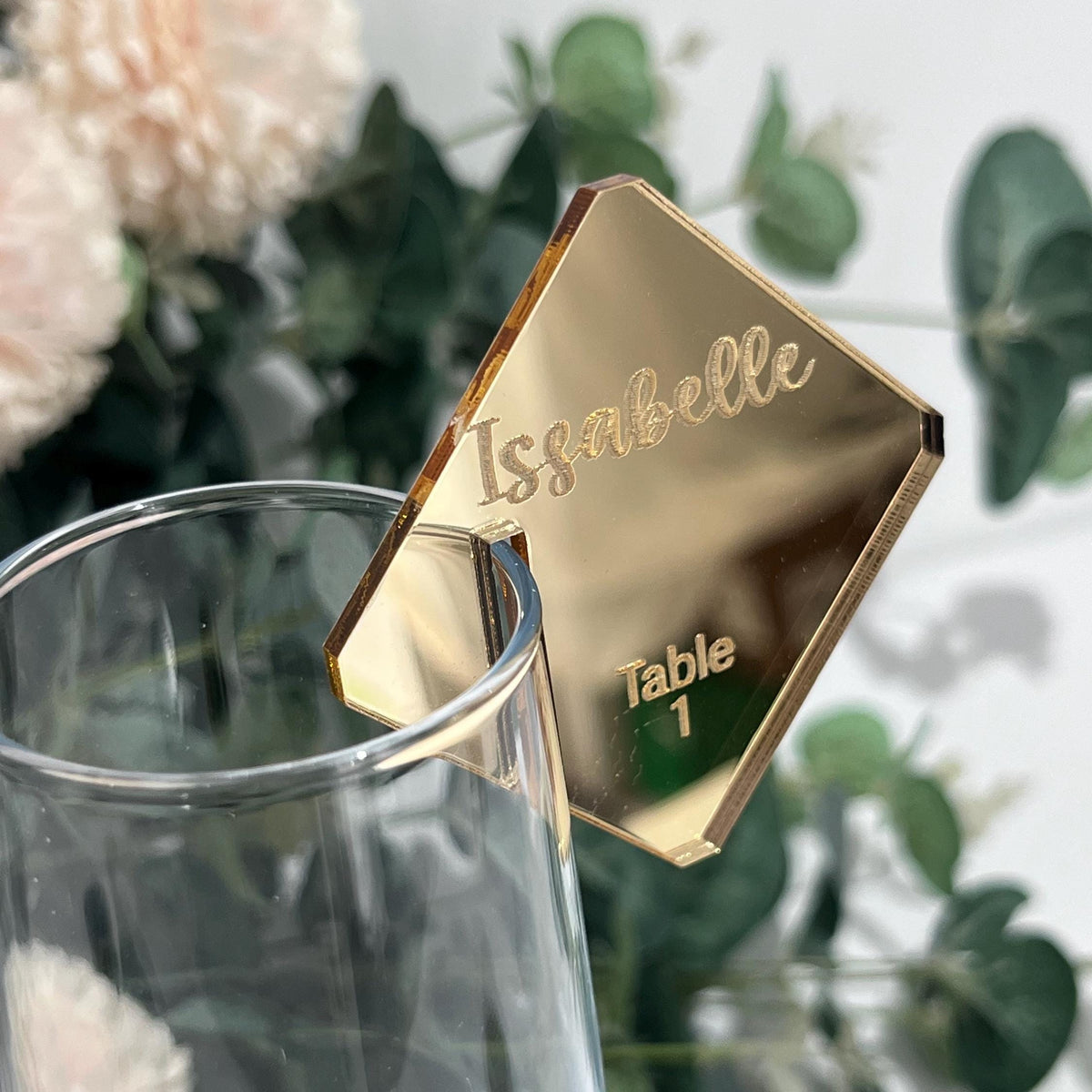 Gold mirror acrylic Champagne Glass Place Card with 'Issabelle' and 'Table 1' engraved text