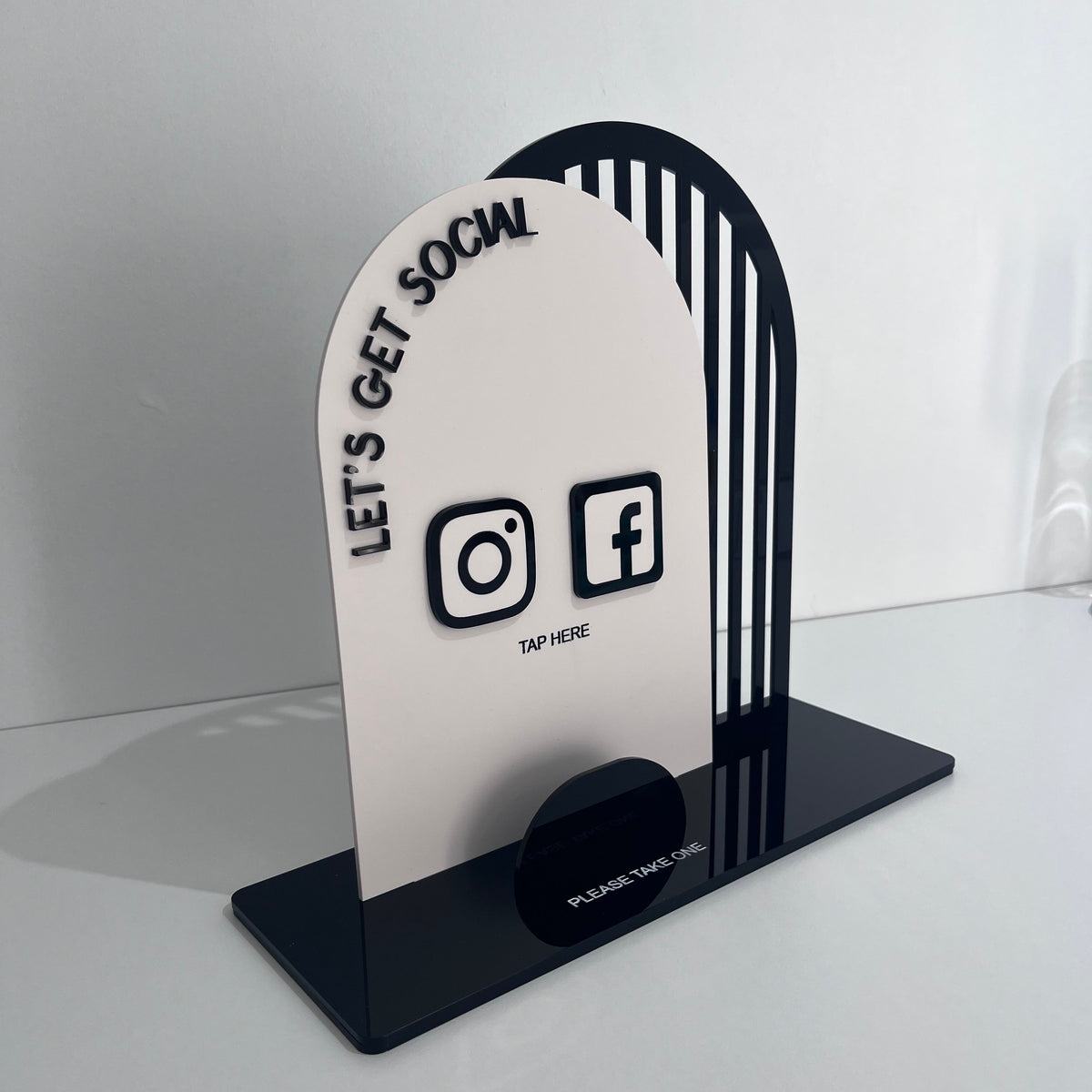 Double Arched NFC Business Sign with the wording 'let's get social' on the front arch with the Facebook and Instagram logos and directions to tap here.