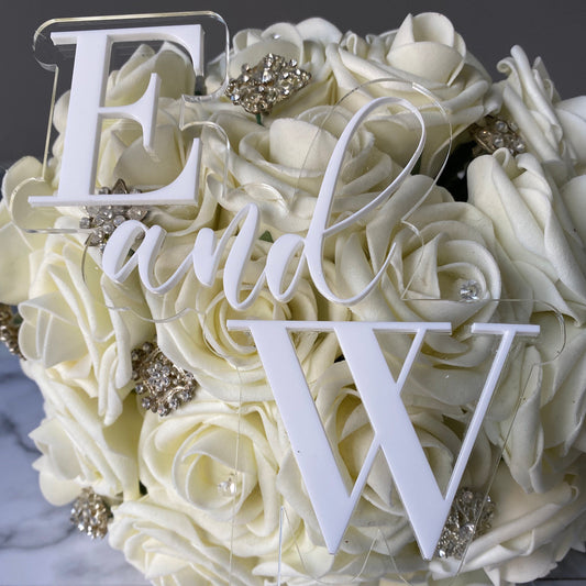 Double Layer Wedding Cake Topper with E and W made from white and clear acrylic