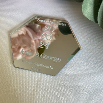 Hexagonal wedding save the date card.
The save the date is made from mirror silver acrylic with the details engraved.