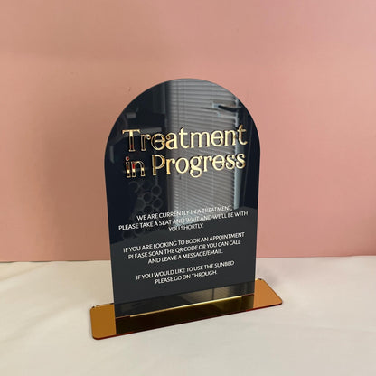 Acrylic sign with 'Treatment in Progress' message 