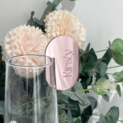 Wedding Place Card that slots on to a wine glass in rose gold mirror acrylic with the name Kirsty engraved in to it