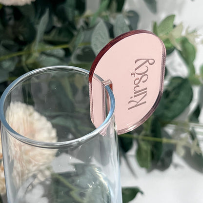 Wedding Place Card that slots on to a wine glass in rose gold mirror acrylic with the name Kirsty engraved in to it