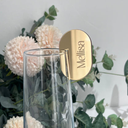 Wedding Place Card that slots on to a wine glass in gold mirror acrylic with the name Melissa engraved in to it