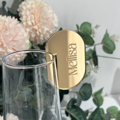 Wedding Place Name that slots on to a wine glass in gold mirror acrylic with the name Melissa engraved in to it