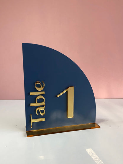 Navy blue table number holder with gold 'Table 1' text 